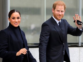 Britain's Prince Harry and Meghan, Duke and Duchess of Sussex, wave as they visit One World Trade Center in Manhattan, New York City, U.S., Sept. 23, 2021.