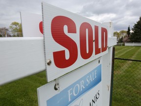 A sold sign is seen outside a house in the tourist destination of Prince Edward County, Ont.