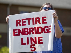 A woman takes part in a protest against Enbridge’s Line 5 pipeline in 2017.