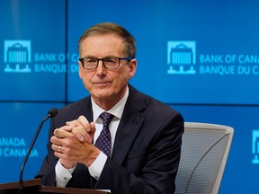 Tiff Macklem, governor of the Bank of Canada, listens during a news conference in Ottawa.