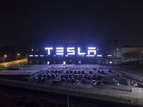 Shares of Tesla surged 13 per cent Monday, lifting its market value above US$1 trillion for the first time