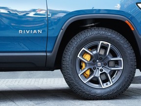 The wheel of a Rivian R1T electric pickup truck during the company's IPO outside the Nasdaq MarketSite in New York, U.S., on Wednesday, Nov. 10, 2021.