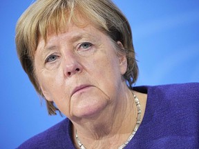 German Chancellor Angela Merkel called for tighter restrictions to help check the spread of COVID-19.