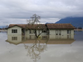 A home surrounded by floodwaters in the Yarrow neighbourhood after rainstorms caused flooding and landslides in Chilliwack, British Columbia.