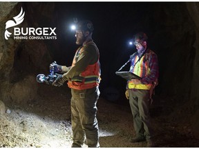 Two Burgex Inc. Mining Consultants technicians operating the ExynPak LiDAR in an underground mine for a 3D modeling project. The handheld LiDAR scanner provides real time point cloud data to the tablet held by the second technician, this tablet provides real-time mapping.