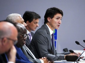 Prime Minister Justin Trudeau, right, takes part in an Oceans Panel Discussion at COP26 in Glasgow, Scotland on Nov. 2, 2021.