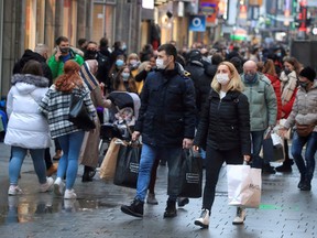 Shoppers in Cologne's main shopping street Hohe Strasse (High Street) in Cologne, Germany on Dec. 12, 2020.