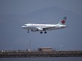 An Air Canada plane lands at San Francisco International Airport from Vancouver on June 30, 2020 in San Francisco, California.