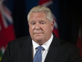 Ontario Premier Doug Ford attends a press briefing in Toronto on Oct. 22, 2021.