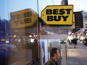 A person exits a Best Buy store in Manhattan, New York City, on Nov. 22, 2021.