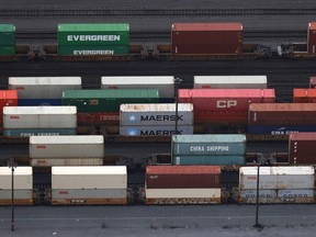 Shipping containers sit idle on railcars on Nov. 20, 2021 in Surrey, B.C.
