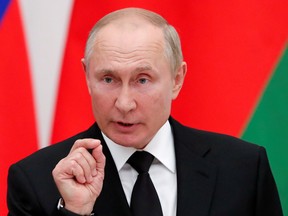Russian President Vladimir Putin speaks during a news conference at the Kremlin in Moscow, Russia, Sept. 9, 2021.