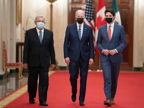 Mexican President Andres Manuel Lopez Obrador, U.S. President Joe Biden and Prime Minister Justin Trudeau arrive for the North American Leaders' Summit in the East Room of the White House in Washington, D.C., on Nov. 18, 2021.