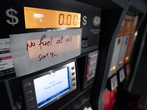 A gas pump with a sign noting no fuel available at a gas station in Agassiz, B.C., on Nov. 17, 2021.