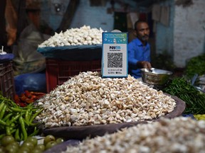 A QR code for Paytm is pictured at a vegetable stall in New Delhi.