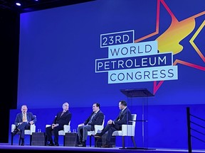 Daniel Yergin, vice chairman of IHS Markit, moderates a panel with John Hess, Joe McMonigle, and Mike Sommers at the World Petroleum Conference in Houston, Texas, U.S. December 7, 2021.