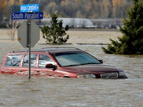 A vehicle is submerged in water after rainstorms caused flooding and landslides in Abbotsford, British Columbia last month.