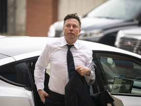 Elon Musk, chief executive officer of Tesla Inc., arrives at court in Wilmington, Delaware.