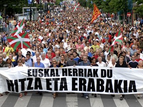 Thousands of people march in the northern Spanish Basque city of San Sebastian during a Basque nationalist demonstration on Aug. 13, 2006. The banner reads in Basque, 'Basque Country has the word and the decision.'
