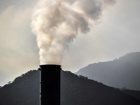 A factory chimney smokes at the industrial complex of Cubatao, Sao Paulo state, Brazil, on Nov. 4, 2021.