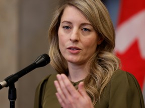 Canada's Minister of Foreign Affairs Melanie Joly speaks during a press conference on Parliament Hill in Ottawa on Dec. 8, 2021.