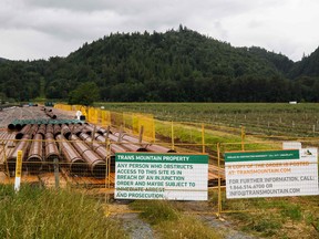 Material for the Trans Mountain Pipeline project sit in a storage lot outside of Abbotsford, B.C., on June 6, 2021.