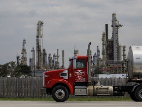 A truck passes a Suncor Energy Inc. oil refinery in Sarnia, Ont., on May 25, 2021.