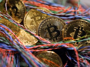 Bitcoins sit among twisted copper wiring at an office in London, U.K., on Sept. 5, 2017.