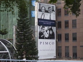 A Pacific Investment Management Company LLC (PIMCO) advertisement on a building in Hong Kong, China.