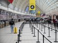 Travelers at Toronto Pearson International Airport in Toronto, on Dec. 16, 2021.