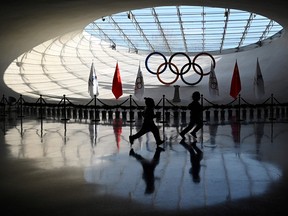 Children run inside the Beijing Olympic Tower in Beijing, host of the 2022 Winter Olympic Games, on Dec. 13, 2021.