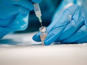 A nurse prepares the Pfizer-BioNTech COVID-19 vaccine for distribution in Montreal.