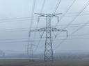 High tension electricity pylons on agricultural land near the Nogent nuclear power plant, operated by Electricite de France SA (EDF), in Nogent-sur-Seine, France, on  Dec. 21, 2021. 