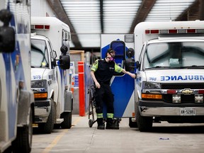 An ambulance crew delivers a patient at Mount Sinai Hospital as officials warned of a "tsunami" of new coronavirus disease (COVID-19) cases in the days and weeks ahead due to the Omicron variant in Toronto, on Jan. 3, 2022.
