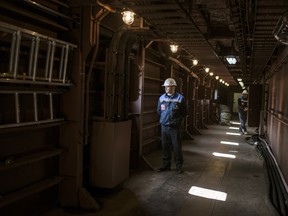 Technical staff in the corridors on the ground floor of the Akademik Lomonosov, a floating nuclear power plant in Murmansk, Russia.