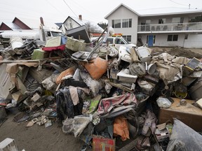 The contents of homes that were flooded pictured on the street in downtown Princeton, B.C., Dec. 3, 2021.