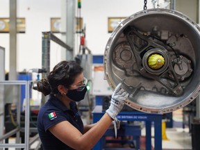 A worker assembles truck transmissions at the Eaton Corp. manufacturing facility in San Luis Potosi, Mexico.