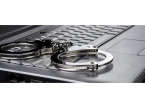 012122-FEATURE-computer-crime-handcuffs-SHUTTERSTOCK