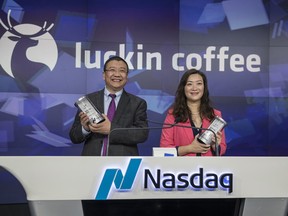 Luckin Coffee Inc executives prepare to ring the opening bell during the company's initial public offering at the Nasdaq in New York,on Friday, May 17, 2019.