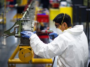 A worker assembles a Twin Otter aircraft wing component at the Viking Air Ltd. manufacturing facility in Victoria, B.C.