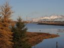 The Syncrude oil sands extraction facility behind near the town of Fort McMurray in Alberta.