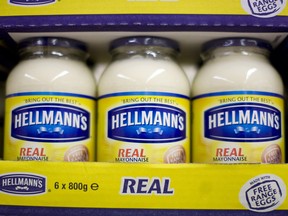 Jars of Hellmann's mayonnaise, produced by Unilever Plc., stand on display at a supermarket in London, U.K.