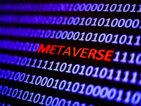 A binary code with the word 'metaverse' displayed on a laptop screen is seen in this multiple exposure illustration photo taken in Krakow, Poland on October 25, 2021. (Photo by Jakub Porzycki/NurPhoto)NO USE FRANCE ORG XMIT: porzycki-metavers211025_npuxU
