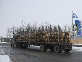 A lumber truck arrives from the U.S. at the border in St-Bernard-de-Lacolle, Quebec, on Jan. 14, 2021.