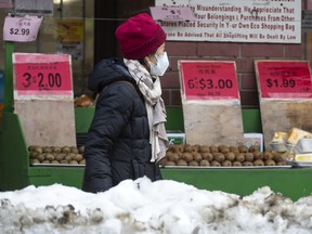 A woman shops for groceries at Toronto's Yao Hua Supermarket on Jan. 19, 2022.