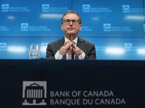 Tiff Macklem, governor of the Bank of Canada, listens during a news conference in Ottawa.