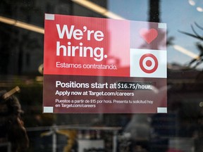 A sign advertising for new employees in the window of a Target store in Hollywood, California.