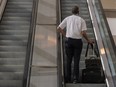 A pilot rides an escalator at Ben Gurion International airport in Tel Aviv, Israel.