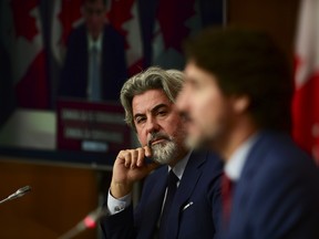 Heritage Minister Pablo Rodriguez, pictured with Prime Minister Justin Trudeau in 2020, is set to introduce legislations as early as Feb. 3.
