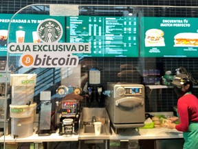 A sign reads: 'Exclusive Bitcoin register' in a Starbucks store where the cryptocurrency is accepted as a payment method, in San Salvador, El Salvador.